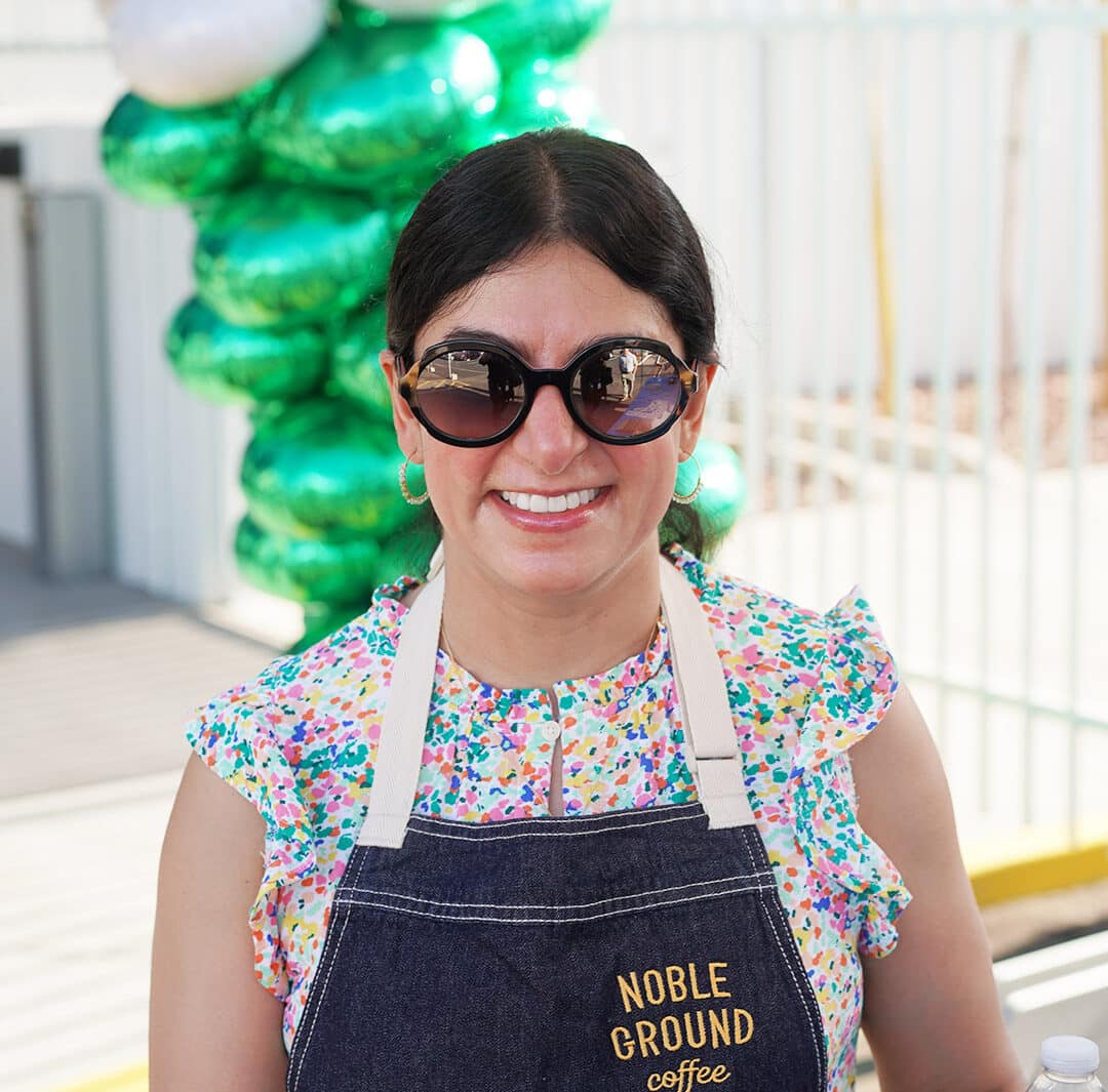 Mona helping Noble Ground Coffee at the 2023 Excel Center Opening
