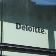 Deloitte sign on building to support In‑House CLO article