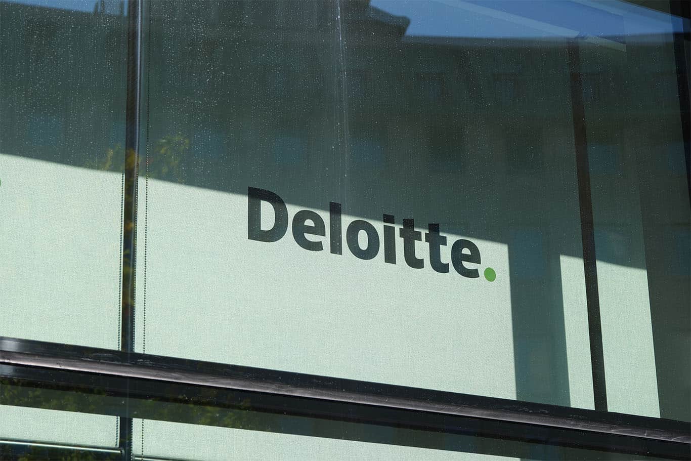 Deloitte sign on building to support In‑House CLO article