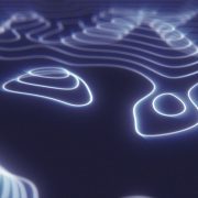 a digital rendering of a futuristic hi-tech landscape created with glowing blue energy circles.