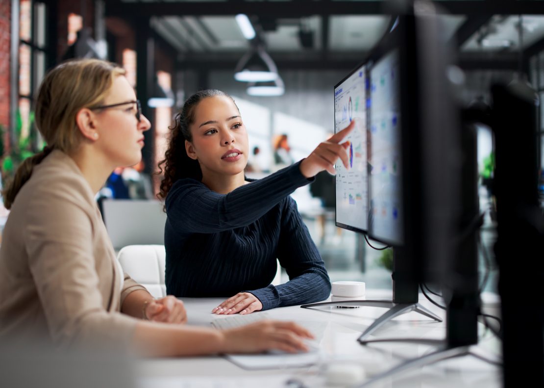 Corporate legal professionals using AI-powered software to streamline legal operations and contract review workflows.