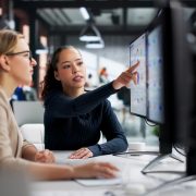 Corporate legal professionals using AI-powered software to streamline legal operations and contract review workflows.