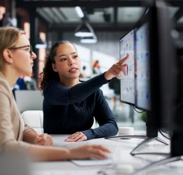 Corporate legal professionals using AI-powered software to streamline legal operations and contract review workflows.