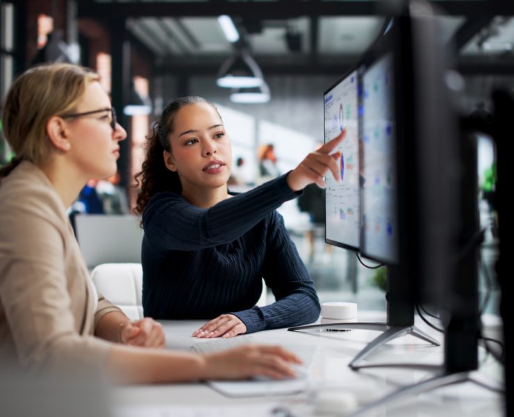 Corporate legal professionals using AI-powered software to streamline legal operations and contract review workflows.