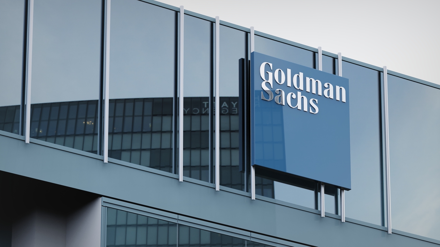 Business professionals overlooking a city financial district as global M&A activity rebounds amid heightened regulatory scrutiny and transaction complexity.