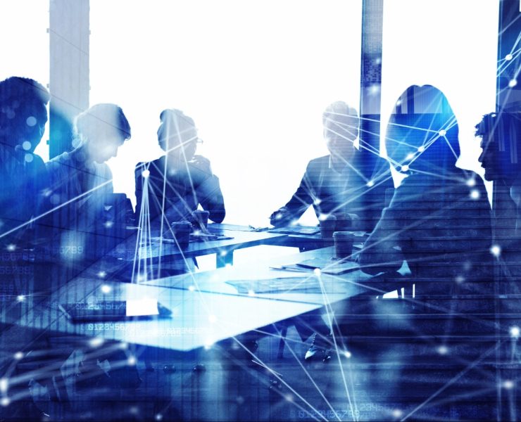 Corporate legal professionals reviewing business strategy and AI governance initiatives in a modern boardroom.