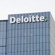 Deloitte company building representing the new survey of legal leaders on AI.