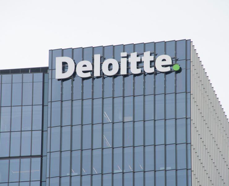 Deloitte company building representing the new survey of legal leaders on AI.