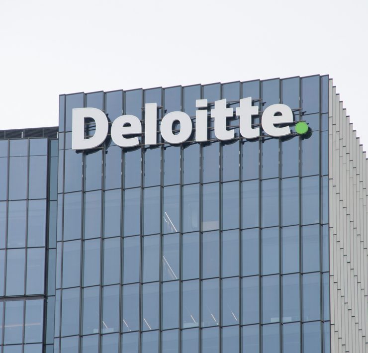 Deloitte company building representing the new survey of legal leaders on AI.