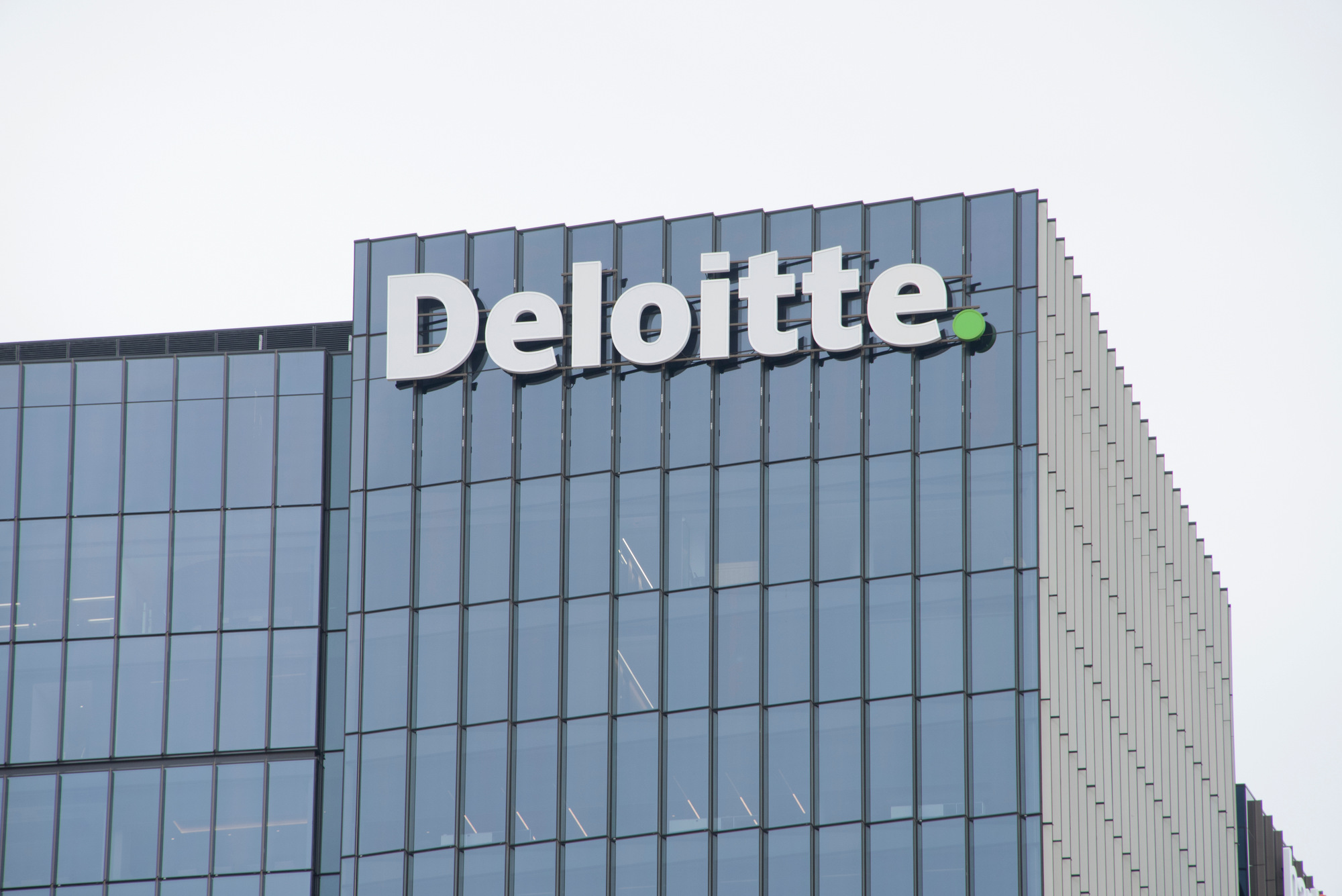 Deloitte company building representing the new survey of legal leaders on AI.