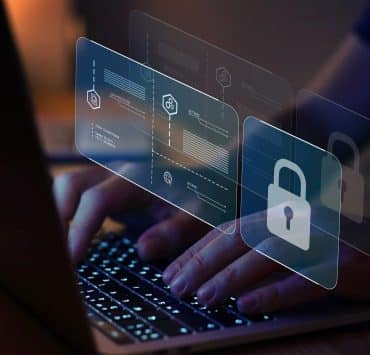 Enterprise cyber risk strategy reviewed in boardroom with digital security visualizations.